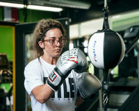 variant:lifestyle::TITLE Boxing Fight Back Boxing Glovesclose up double end bag