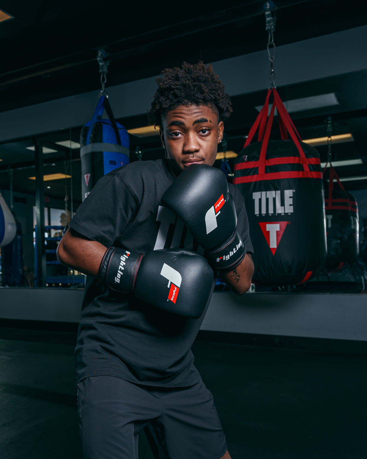 variant:black::Fighting Leather Heavy Bag Gloves boxing pose