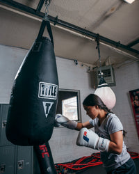 variant:white::Fighting Leather Heavy Bag Gloves girl hitting bag