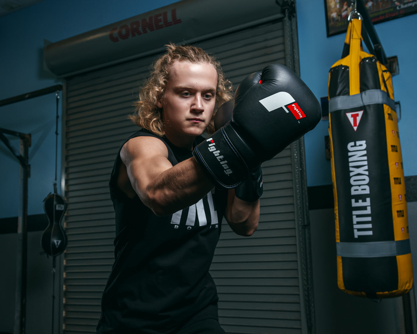 variant:black::Fighting Leather Training Gloves fifth view kid left jab up