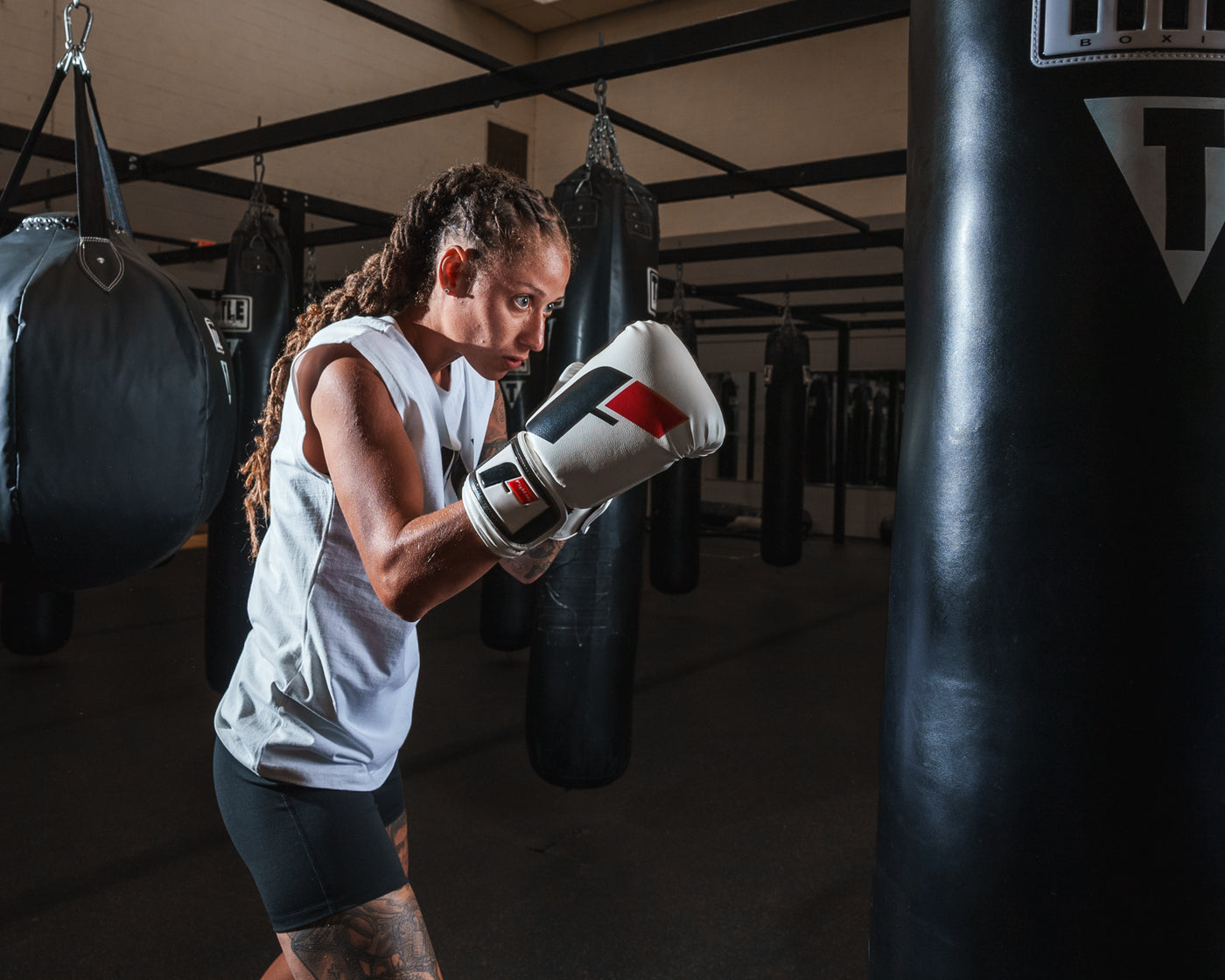 variant:white/black/red::Fighting Big Logo Boxing Gloves girl hitting bag
