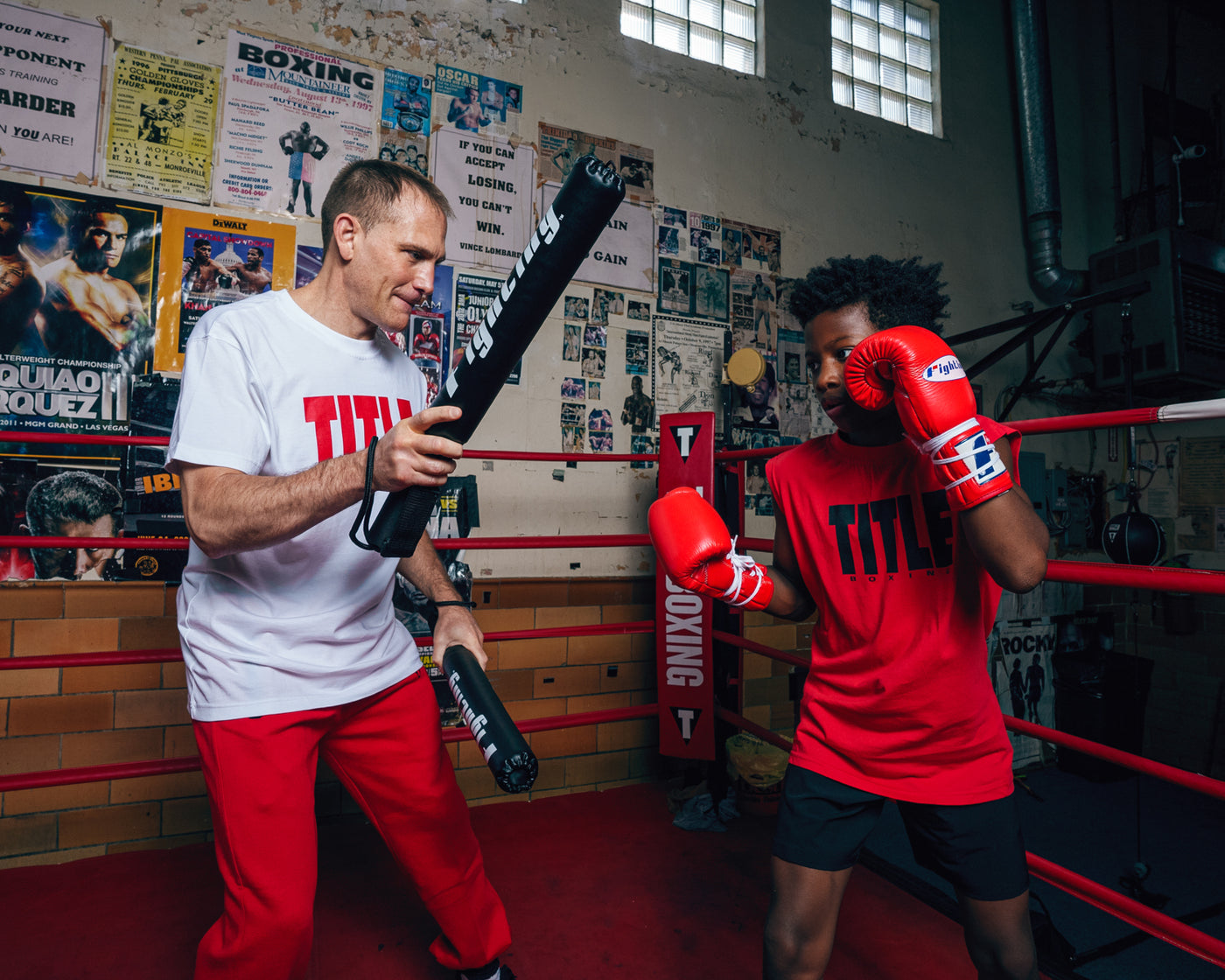variant:lifestyle::Fighting Combat Striking Sticks kid on right with coach on left