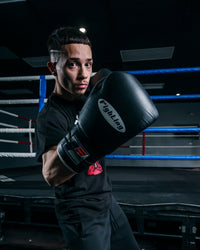 variant:black::Fighting Fury Professional Lace Training Gloves guy right jab