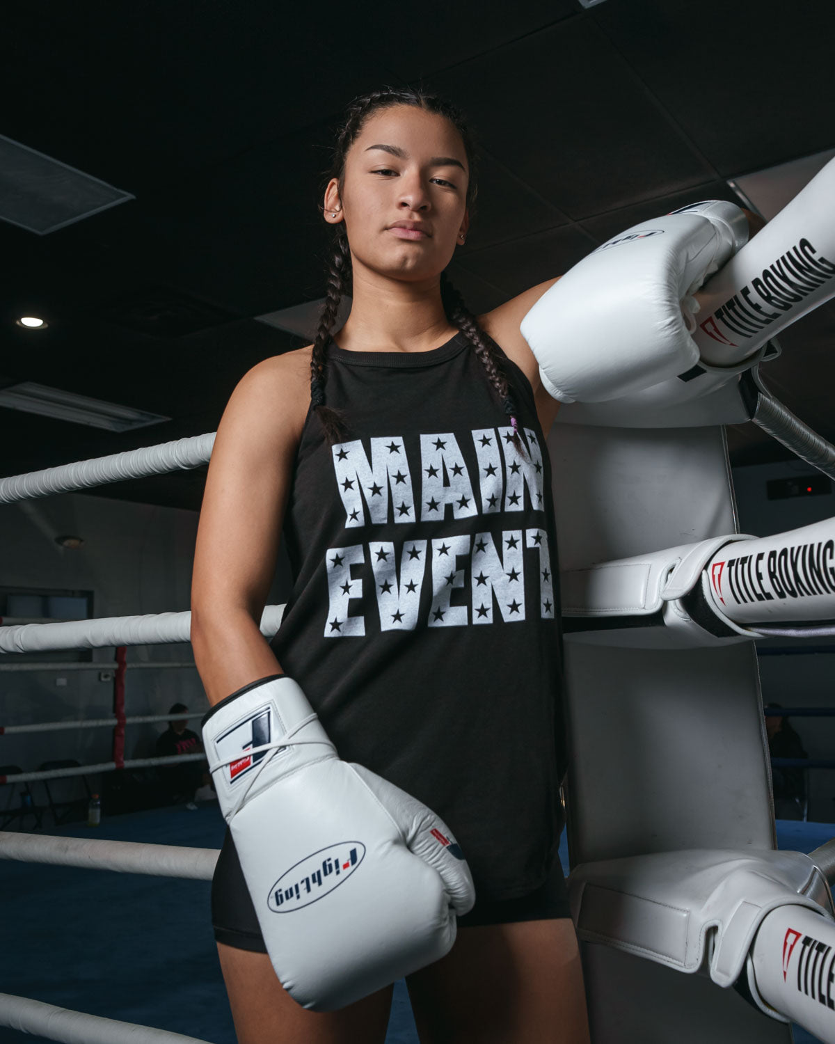variant:white::Fighting Fury Professional Lace Training Gloves girl standing on ring post