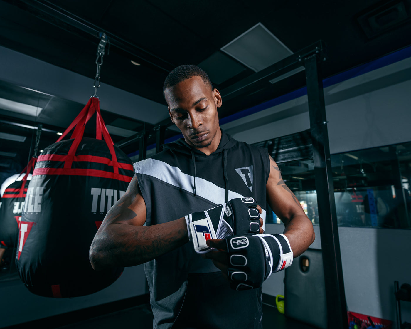 variant:lifestyle::Fighting S2 Pro GEL Glove Wraps  putting on