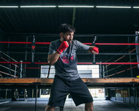 variant:Red::Fighting Semi-Elastic 180" Hand Wraps boy between hand wraps boxing stance
