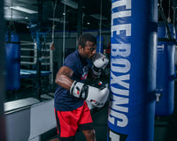 variant:White/Black::Fighting S2 GEL Power Sparring Gloves hitting bag right hook