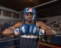 variant:blue::Fighting USA Boxing Competition Open Face Headgear guy in ring with gloves on to match blue
