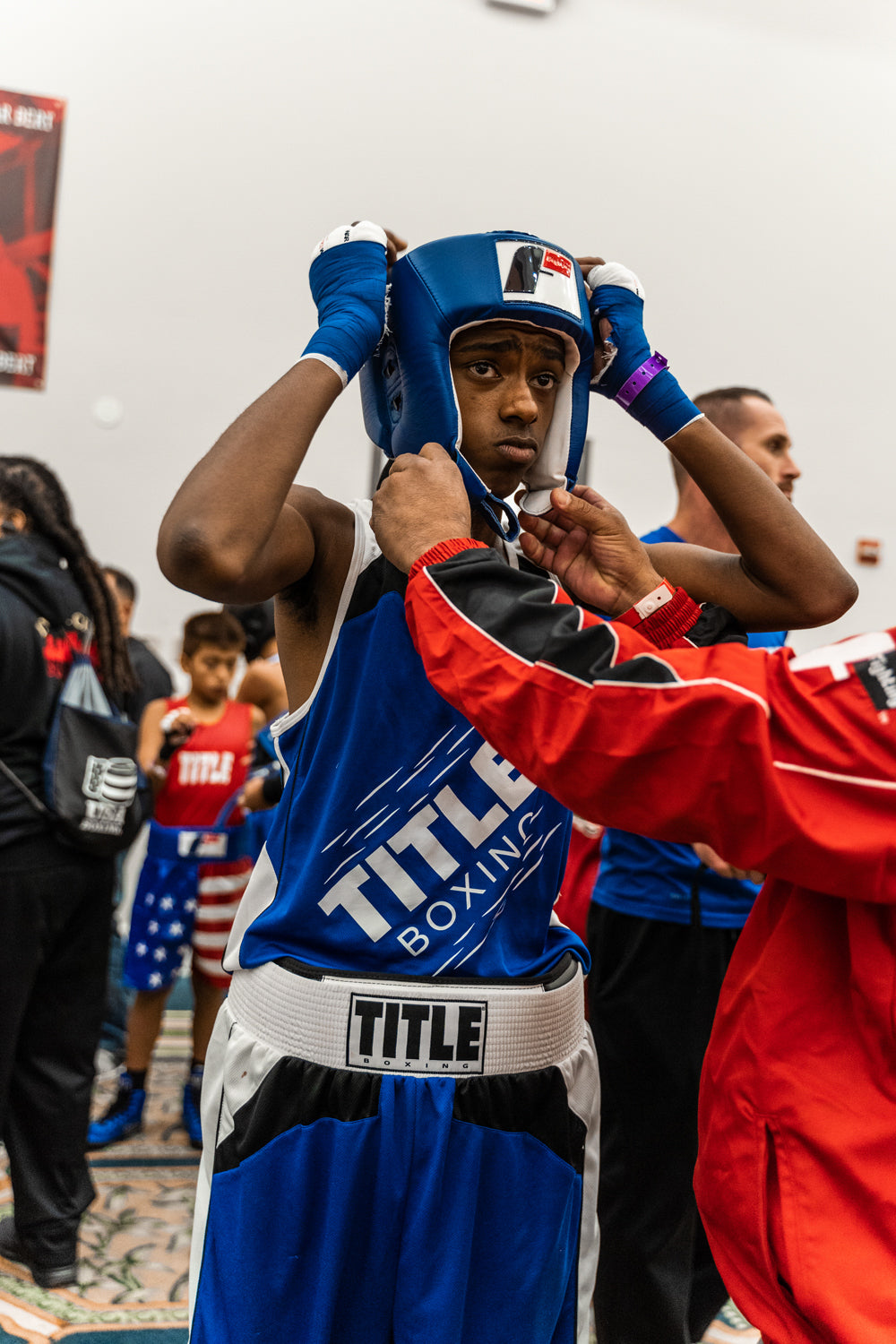 variant:blue::Fighting USA Boxing Competition Open Face Headgear putting on headgear