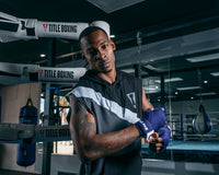 variant:blue/white::Fighting 180" Semi Elastic Hand Wraps guy looking at camera putting on