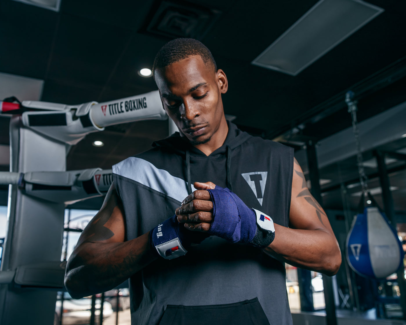 variant:blue/white::Fighting 180" Semi Elastic Hand Wraps guy looking down hands together