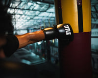 variant:lifestyle::TITLE Boxing Gel Generation Leather Lace Sparring Gloves hitting punching bag