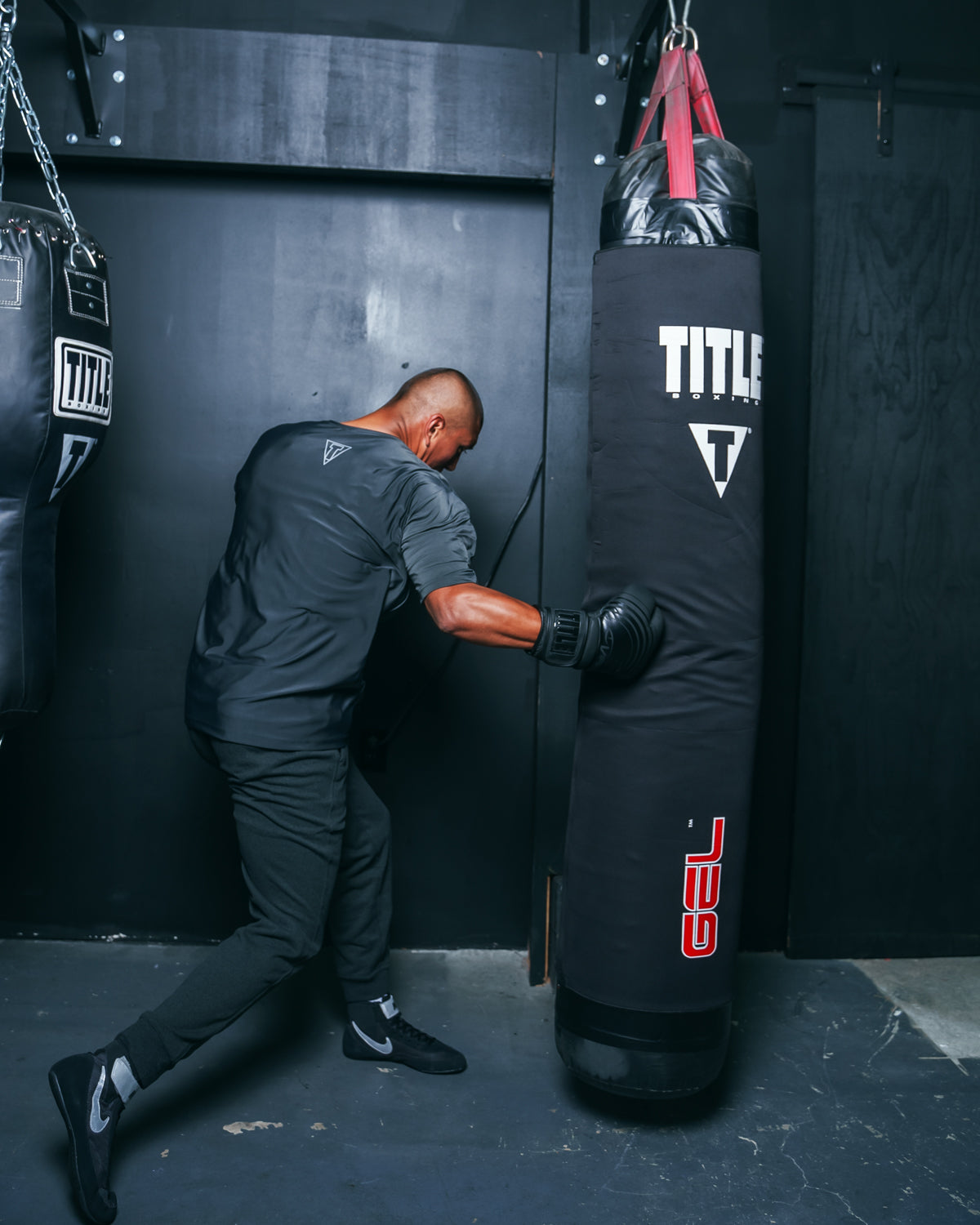 variant:lifestyle::TITLE Boxing Gel Intense Heavy Bag Striking Sleeve man punching bag