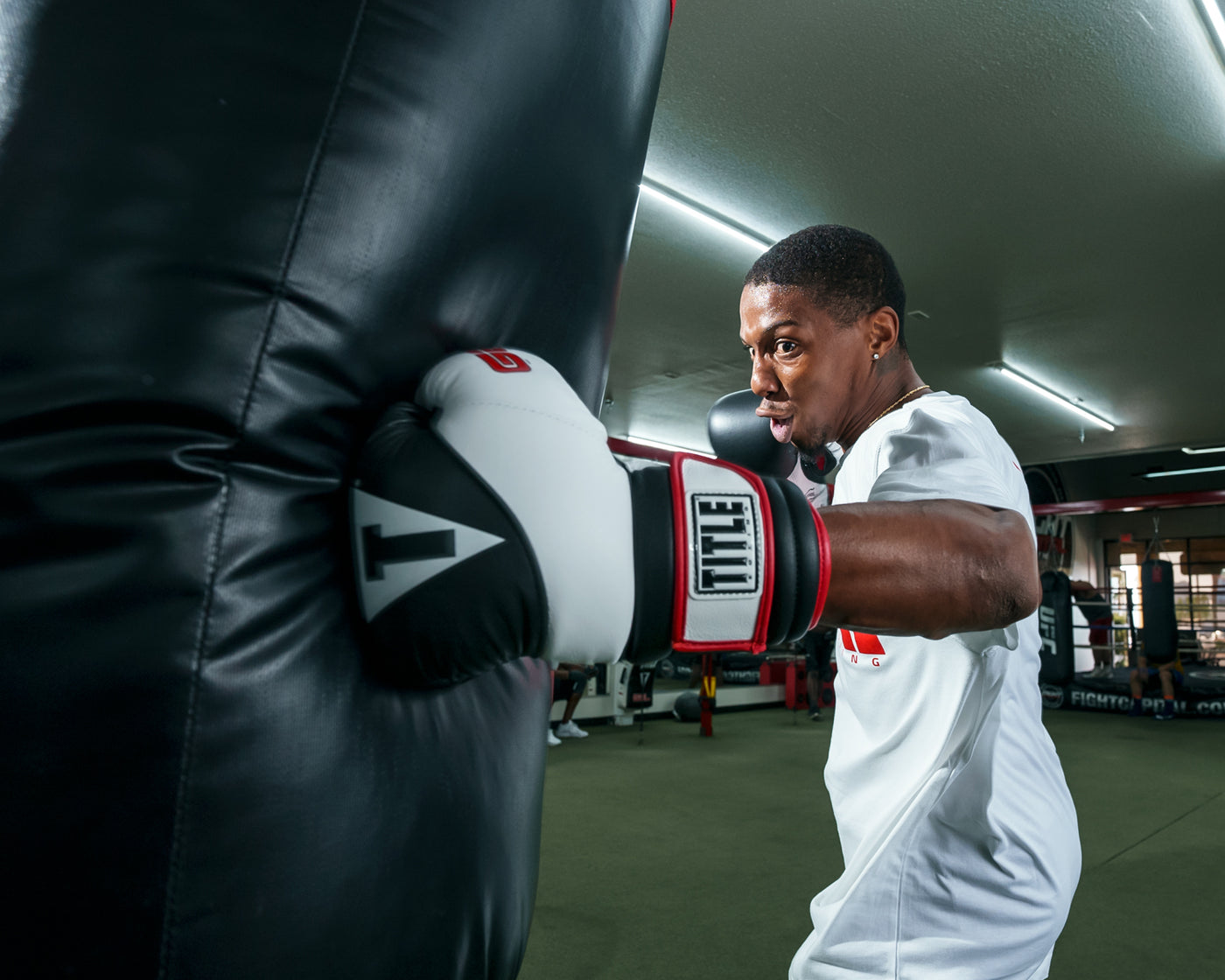 variant:Black/White::TITLE Boxing Gel Suspense Training Gloves boxer left jab bag