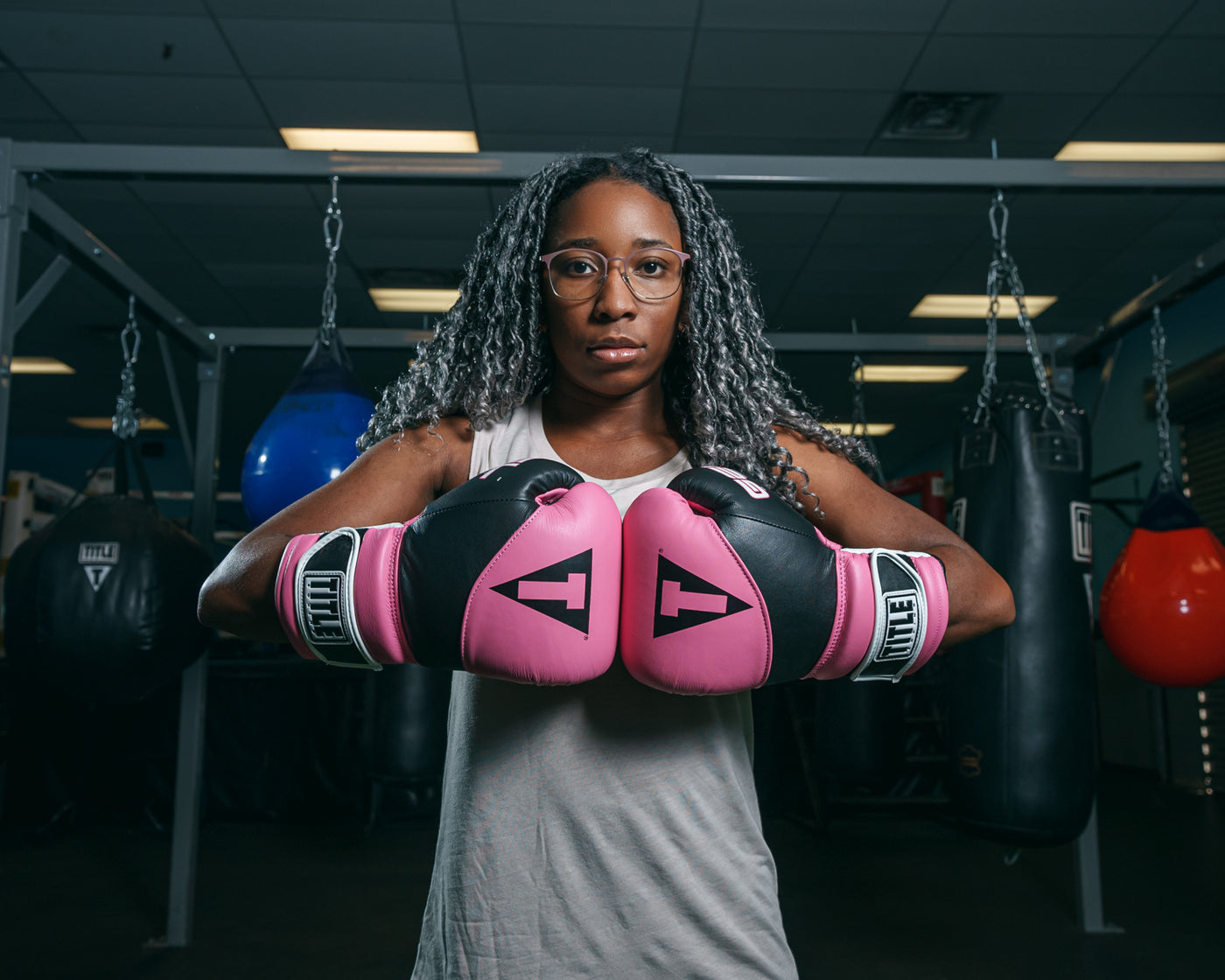 variant:Pink/Black::TITLE Boxing Gel Suspense Training Gloves lady hands together
