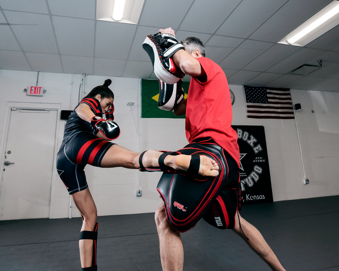 variant:lifestyle::TITLE MMA Gel Thai Style Thigh Pads 2.0 lady kicking pads