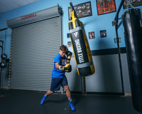 variant:black/gold::TITLE Boxing Gel World V2T Bag Glove guy hitting bag right jab long shot