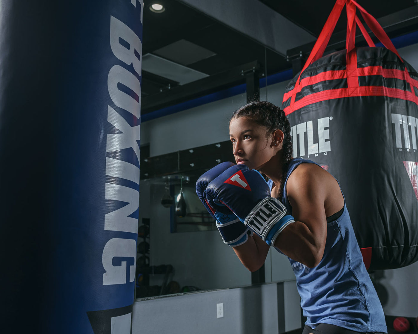 variant:navy/navy::TITLE Boxing Gel World V2T Bag Gloves boxing stance with bag
