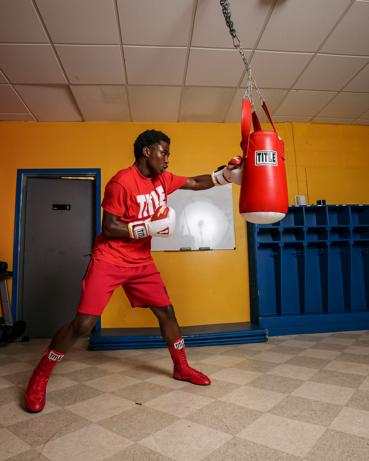 variant:white/red/gold::TITLE Boxing Gel World V2T Bag Gloves man hitting bag