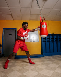 variant:white/red/gold::TITLE Boxing Gel World V2T Bag Gloves man hitting bag
