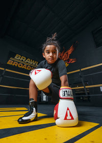 variant:white/red/gold::TITLE Boxing Gel World V2T Bag Gloves  kneeling on ring