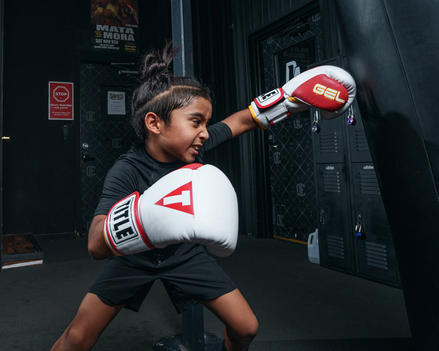 variant:white/red/gold::TITLE Boxing Gel World V2T Bag Gloves  kid hitting bag