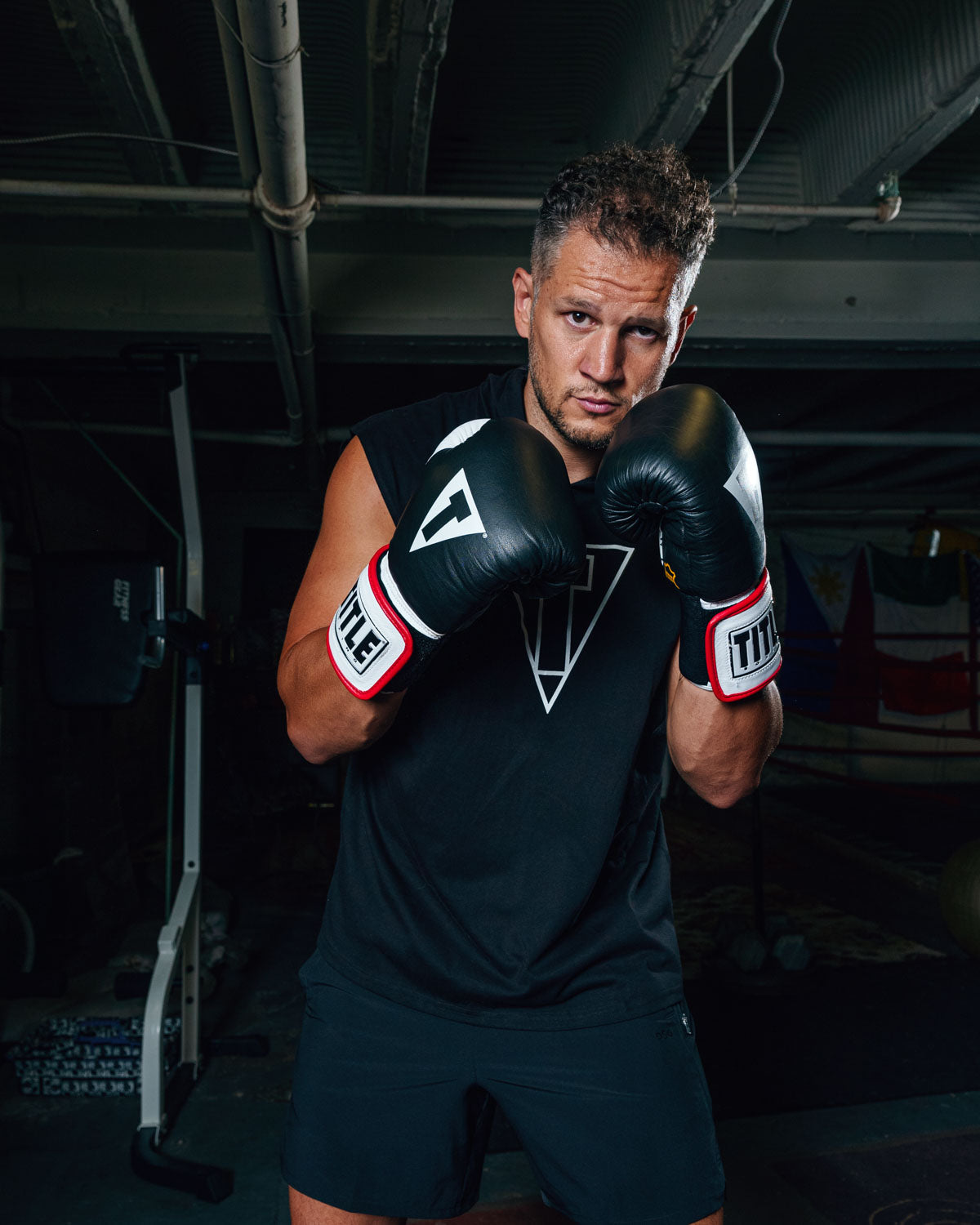 variant:Black::TITLE Boxing Gel World Elastic Training Gloves guy boxing stance