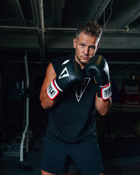 variant:Black::TITLE Boxing Gel World Elastic Training Gloves guy boxing stance