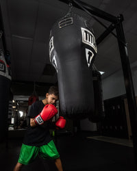 variant:black::TITLE Boxing Big Bang Heavy Bag kid hitting bag