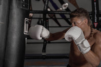 variant:lifestyle::TITLE Boxing Professional Choice 125lb Leather Heavy Bag guy right jab