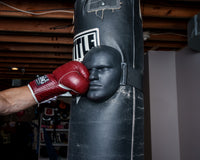 variant:lifestyle::TITLE Boxing Heavy Bag Striking Mask around bag hitting face