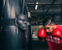 variant:Lifestyle::TITLE Boxing Heavy Bag Striking Mask guy getting ready to hit mask