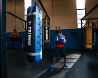 variant:150 lbs::TITLE Boxing Greatest Heavy Bag Ever kid boxing stance with bag