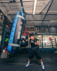variant:150 lbs::TITLE Boxing Greatest Heavy Bag Ever boy hitting bag