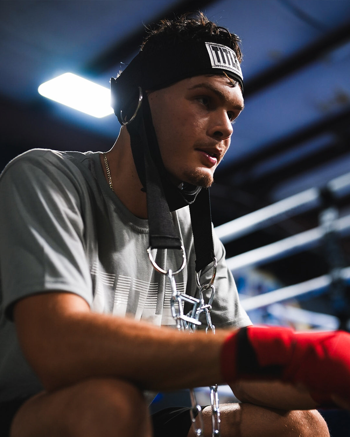 variant:lifestyle::TITLE Boxing Nylon Head Harness 2.0 on fighter closeup of headstrap with head up