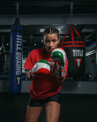 variant:lifestyle::TITLE Boxing Infused Foam EI Combat Mexico Training Gloves girl boxing pose