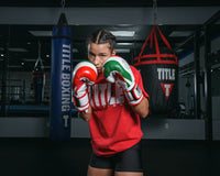variant:lifestyle::TITLE Boxing Infused Foam EI Combat Mexico Training Gloves girl boxing stance hands up