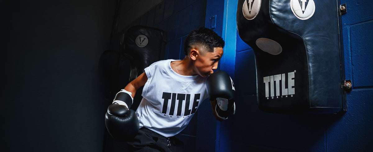 young boxer using a specialty boxing punching bag