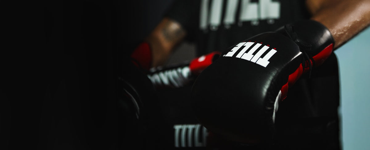 TITLE Boxing training gloves on a boxer