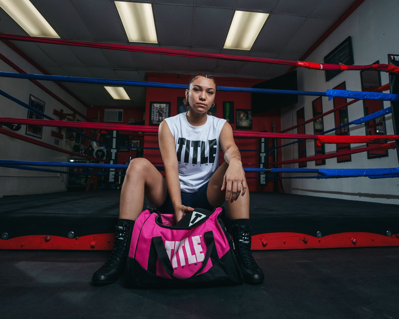 variant:pink::TITLE Boxing Individual Sport Bag pulling out gloves out of bag