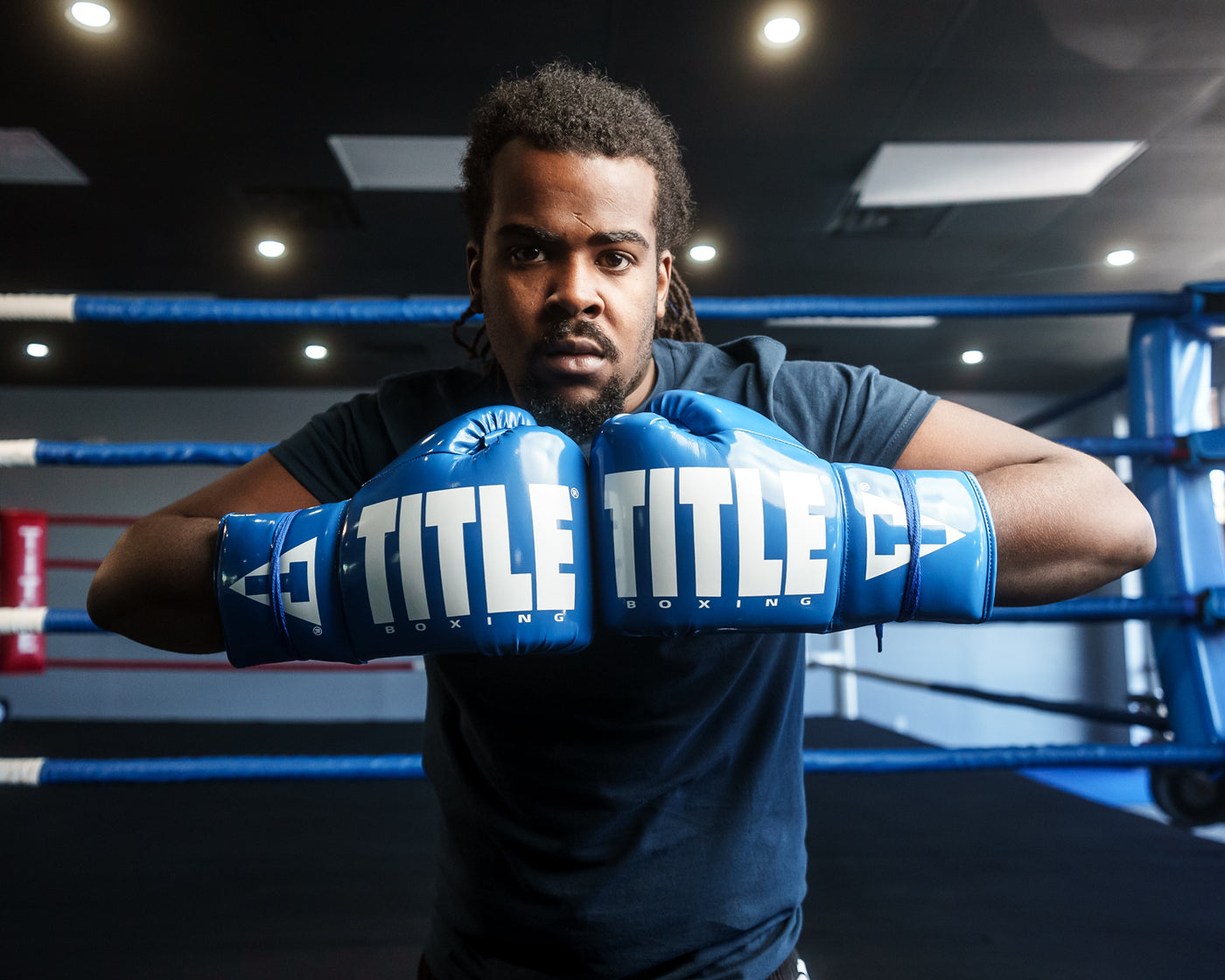 variant:Blue/White::TITLE Boxing Inferno Intensity Lace Training Gloves guy hands together