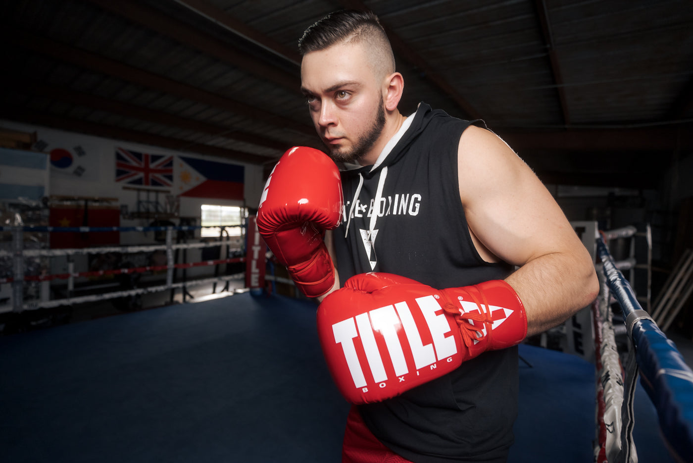 variant:Red/White::TITLE Boxing Inferno Intensity Lace Training Gloves guy boxing pose 