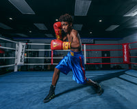 variant:blue::KRONK Boxing Gym Trunks standing in ring boxing stance