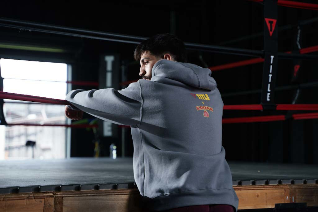 variant:Dark Grey::TITLE Boxing Legacy KRONK Training Camp Hoodie guy with his back turned