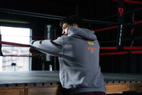 variant:Dark Grey::TITLE Boxing Legacy KRONK Training Camp Hoodie guy with his back turned