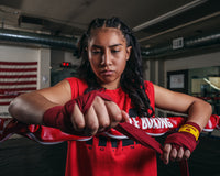 varaint:red::KRONK Boxing Gym Hand Wraps girl putting on wraps