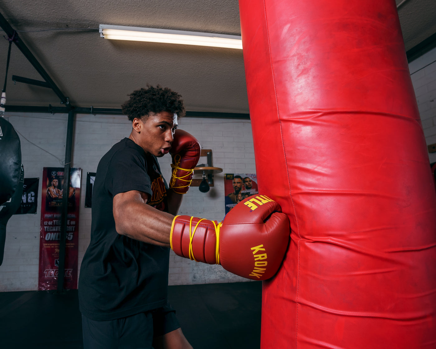 variant:Red/Gold::KRONK Boxing Gym Lace-Up Training Gloves kid hitting bag