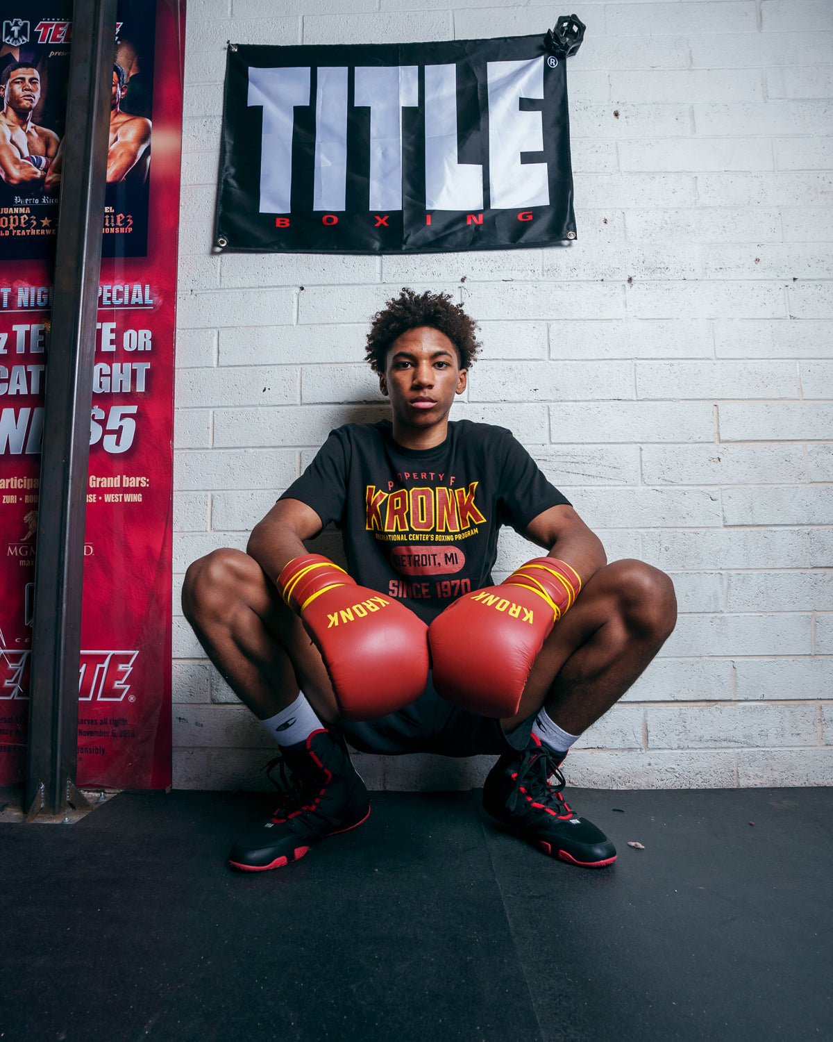 variant:Red/Gold::KRONK Boxing Gym Lace-Up Training Gloves kid on the wall