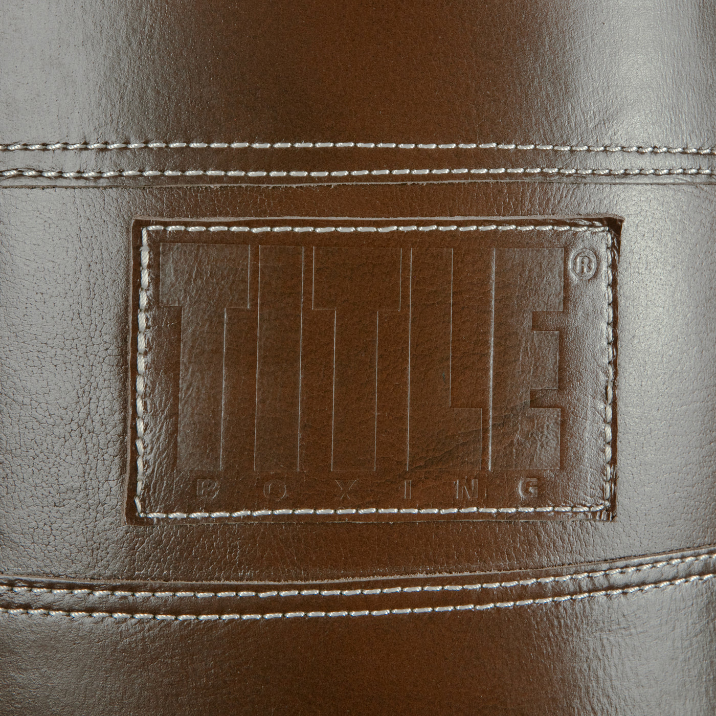 variant:brown::TITLE Boxing KO-Vert Leather Heavy Bag closeup of logo