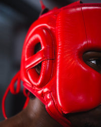 variant:red::TITLE Boxing KO-Vert Stealth Headgear on boxer closeup of side